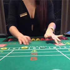 Filipino player using winph99 mobile app on a smartphone to place a sports bet
